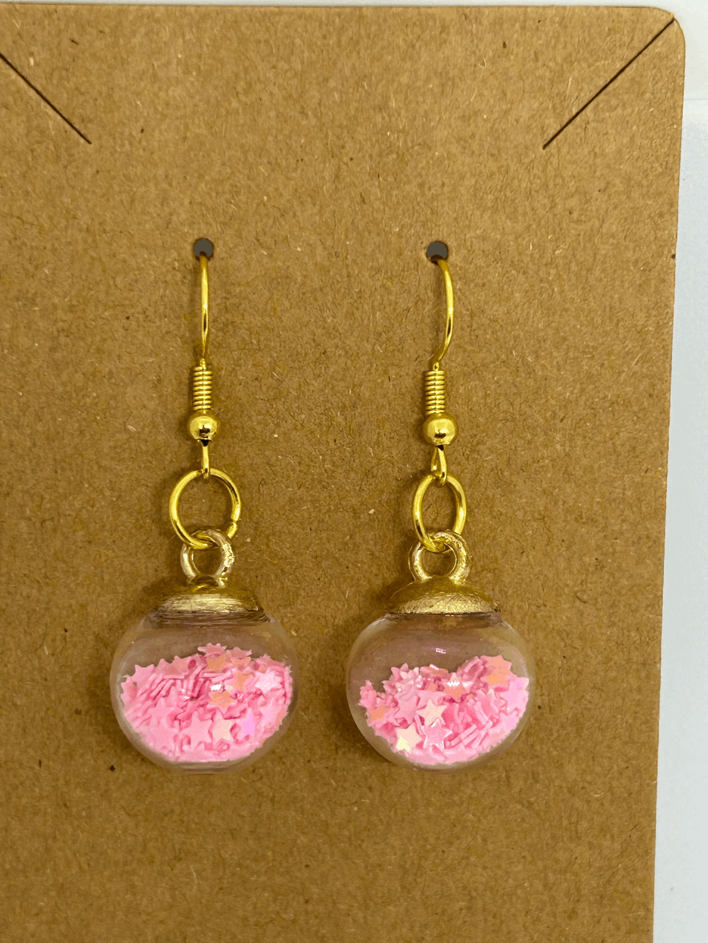 Pink star glass globe earrings