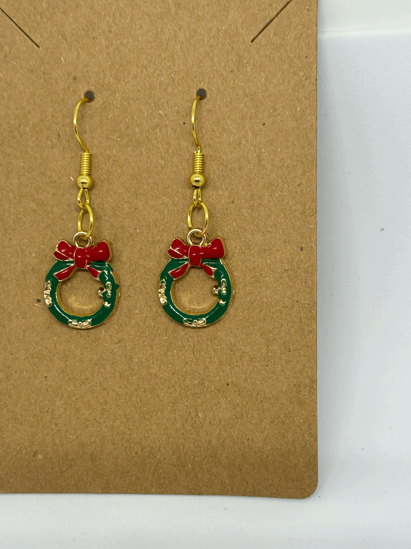 Green miniture wreath with a red bow earring