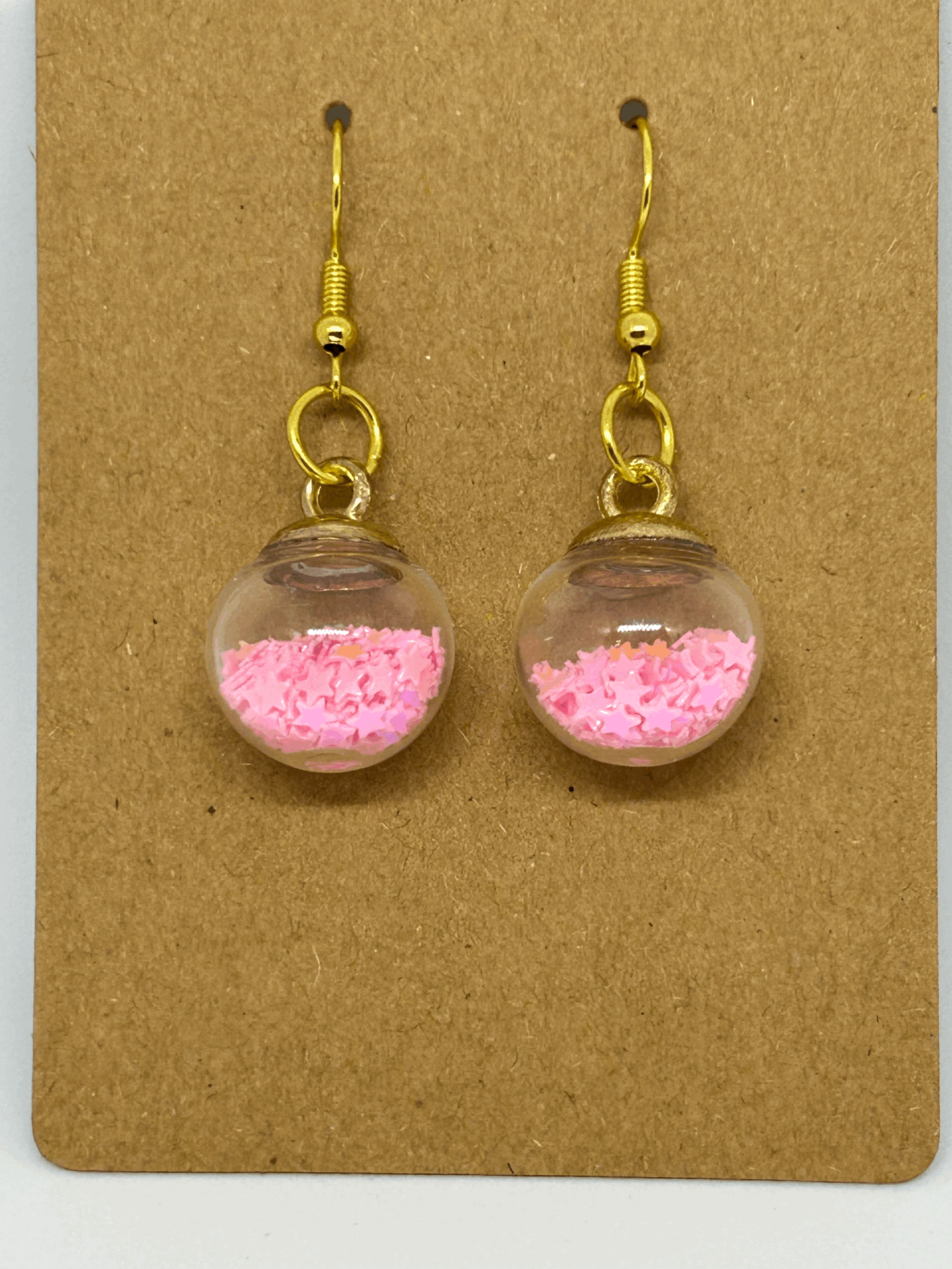 Pink star glass globe earrings