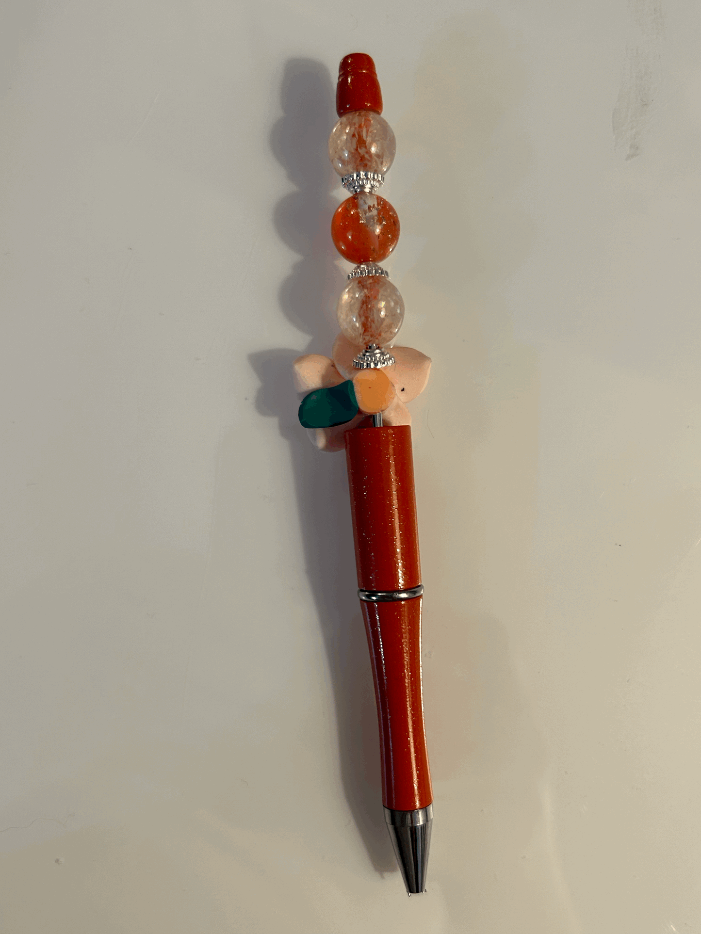 Pink flower with red and cream bead ball point pen