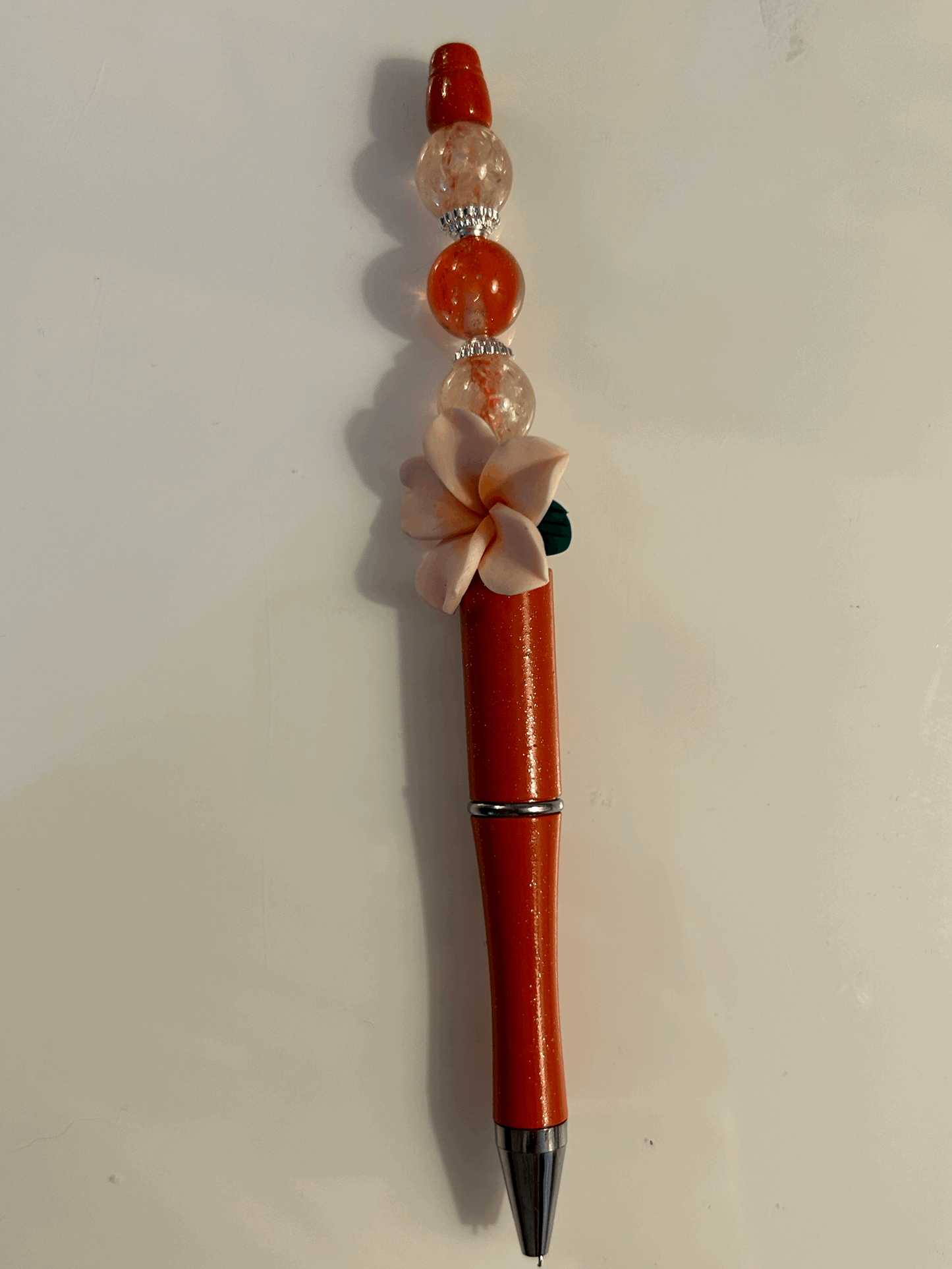 Pink flower with red and cream bead ball point pen