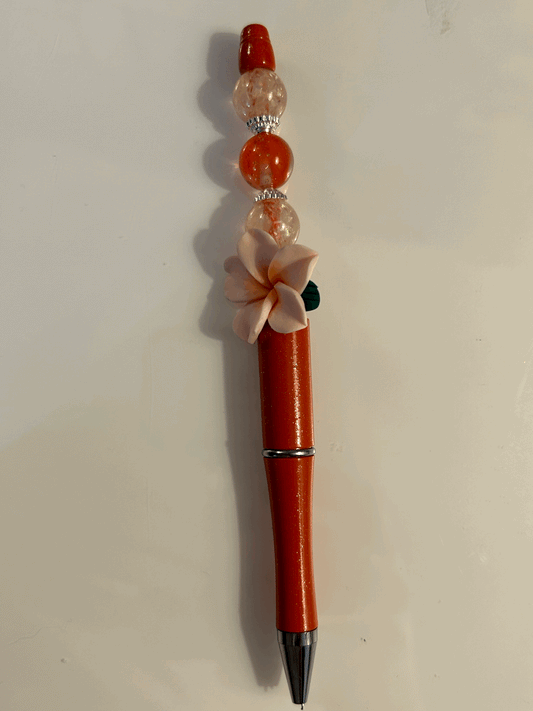 Pink flower with red and cream bead ball point pen